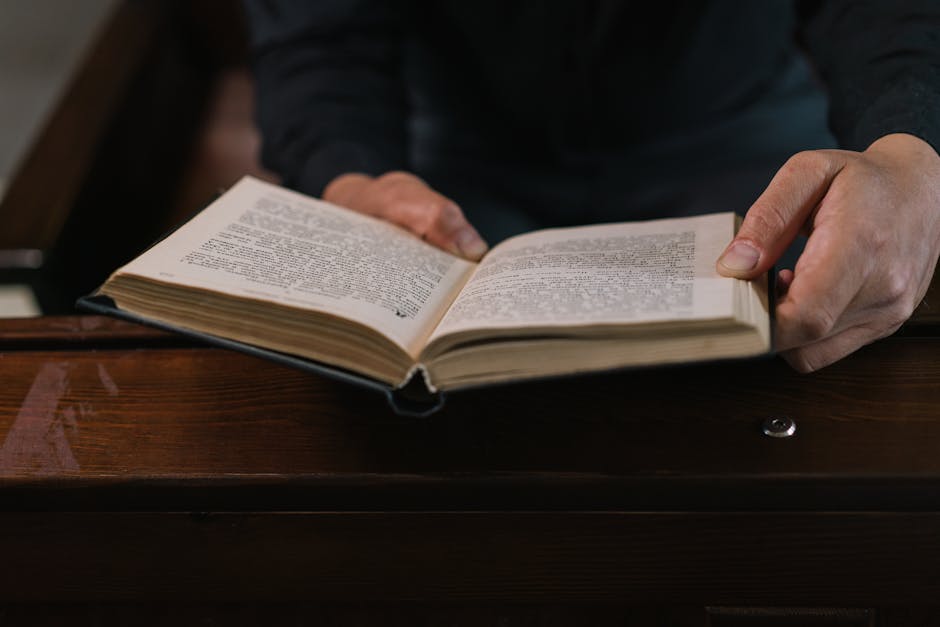 Hands open book spiritual setting