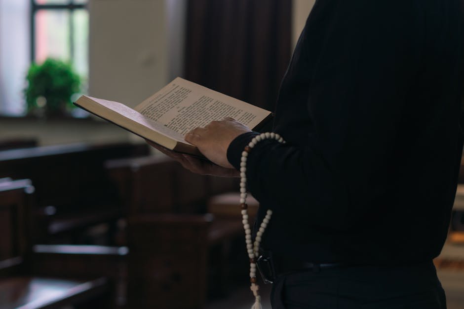 Person praying holy book
