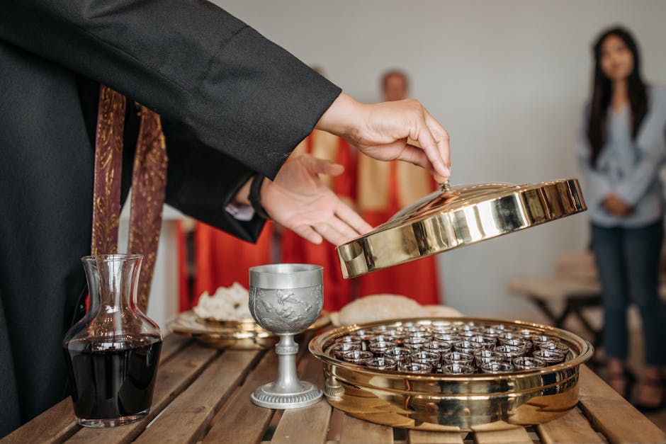 Priest communion wine chalice