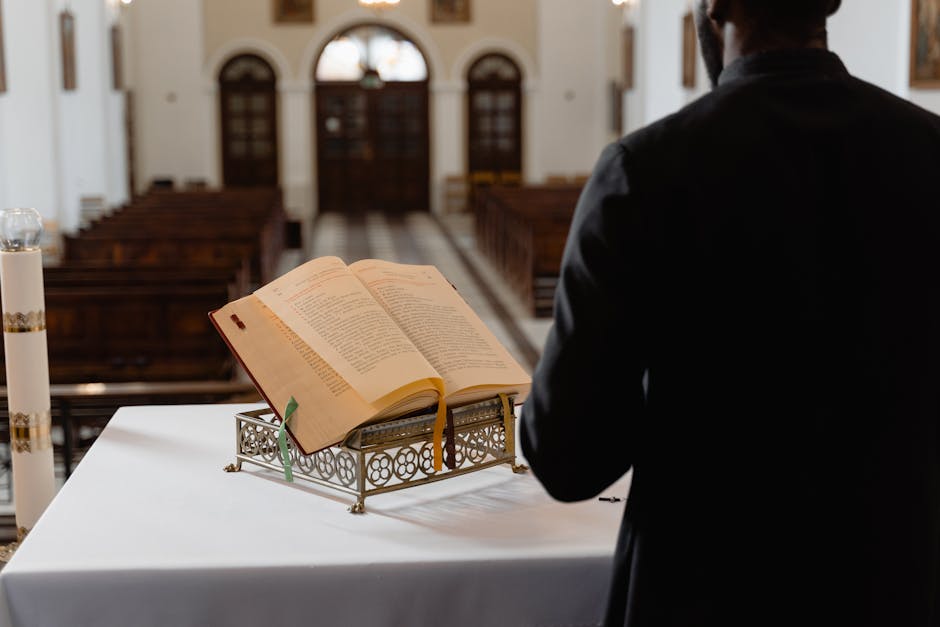 Priest reading Bible in a serene interior