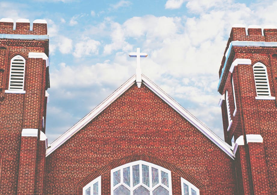 Red brick arched windows under the sky