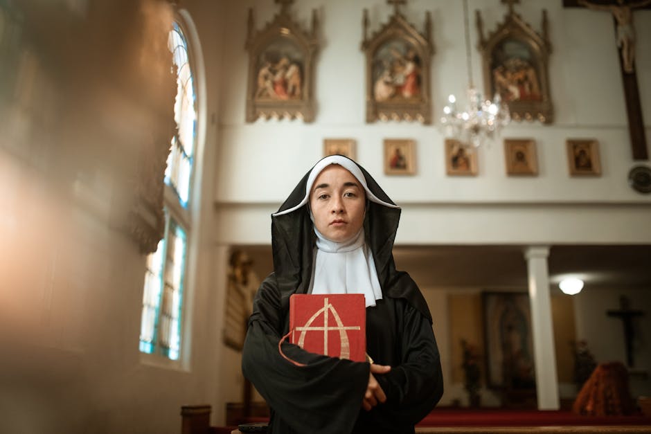 Solemn nun holding bible