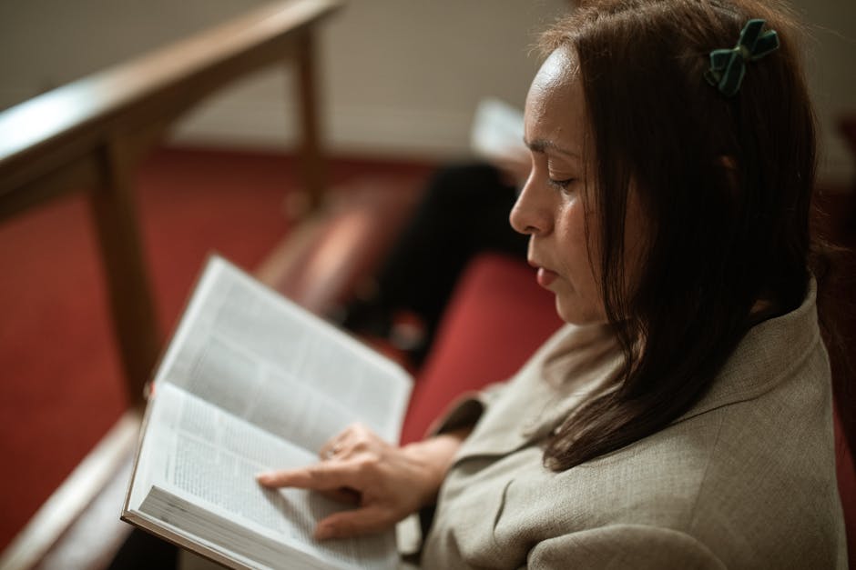 Woman reading bible pew